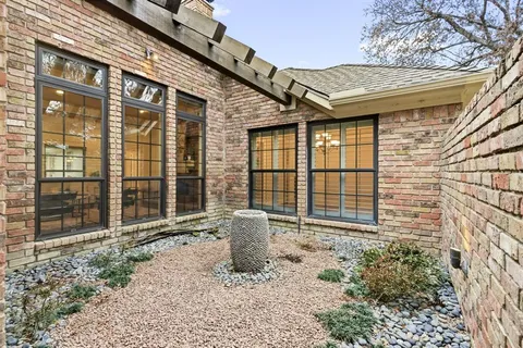 a living room with furniture wooden floor and a fireplace