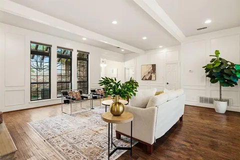 a kitchen with granite countertop stainless steel appliances stove microwave and cabinets