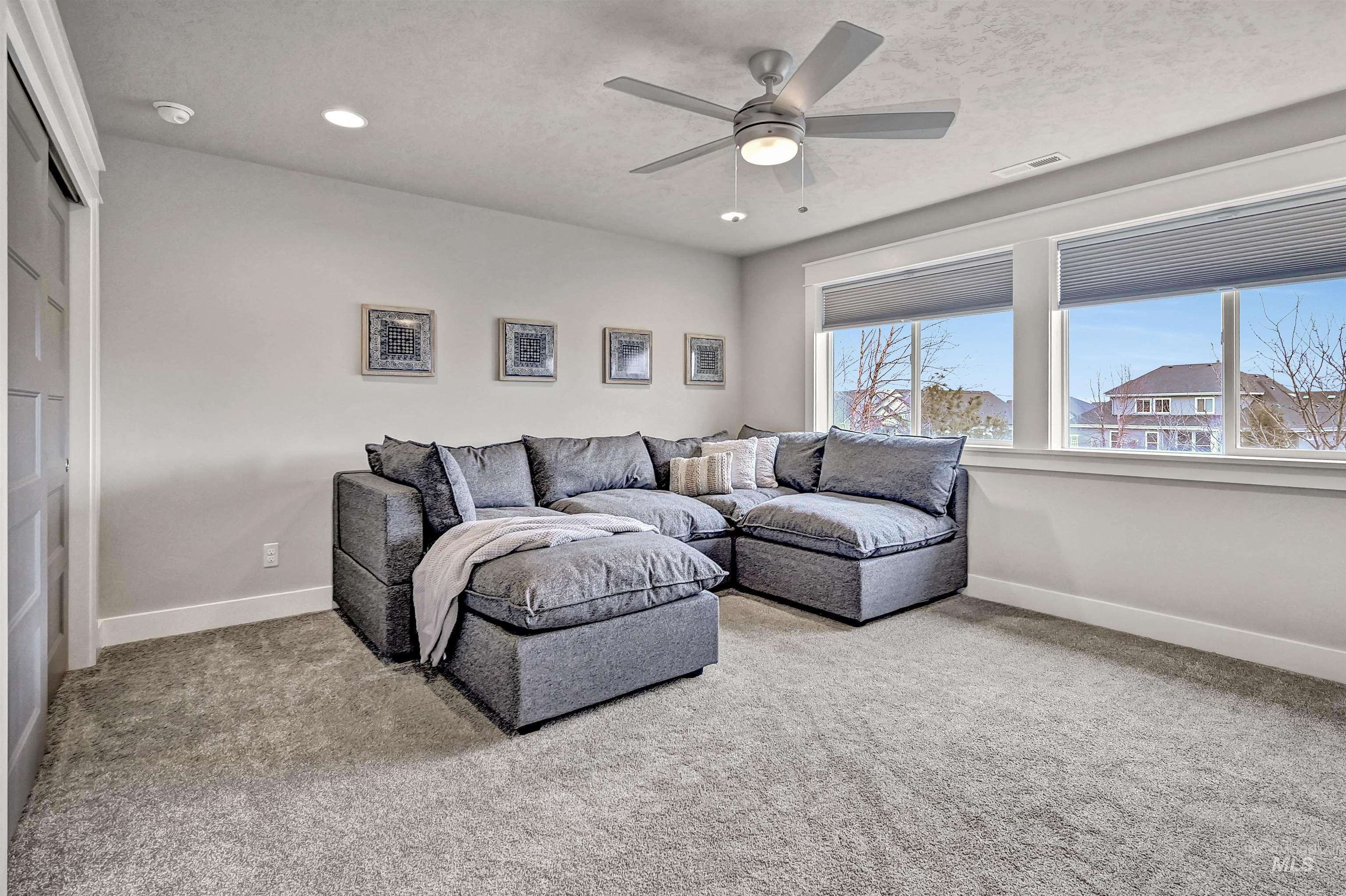 5802 South Wayland Way Meridian, ID 83642 - Photo 23 of 35 Bedroom featuring light carpet and expansive windows; easily used as a bonus room if no need for a 5th bedroom.