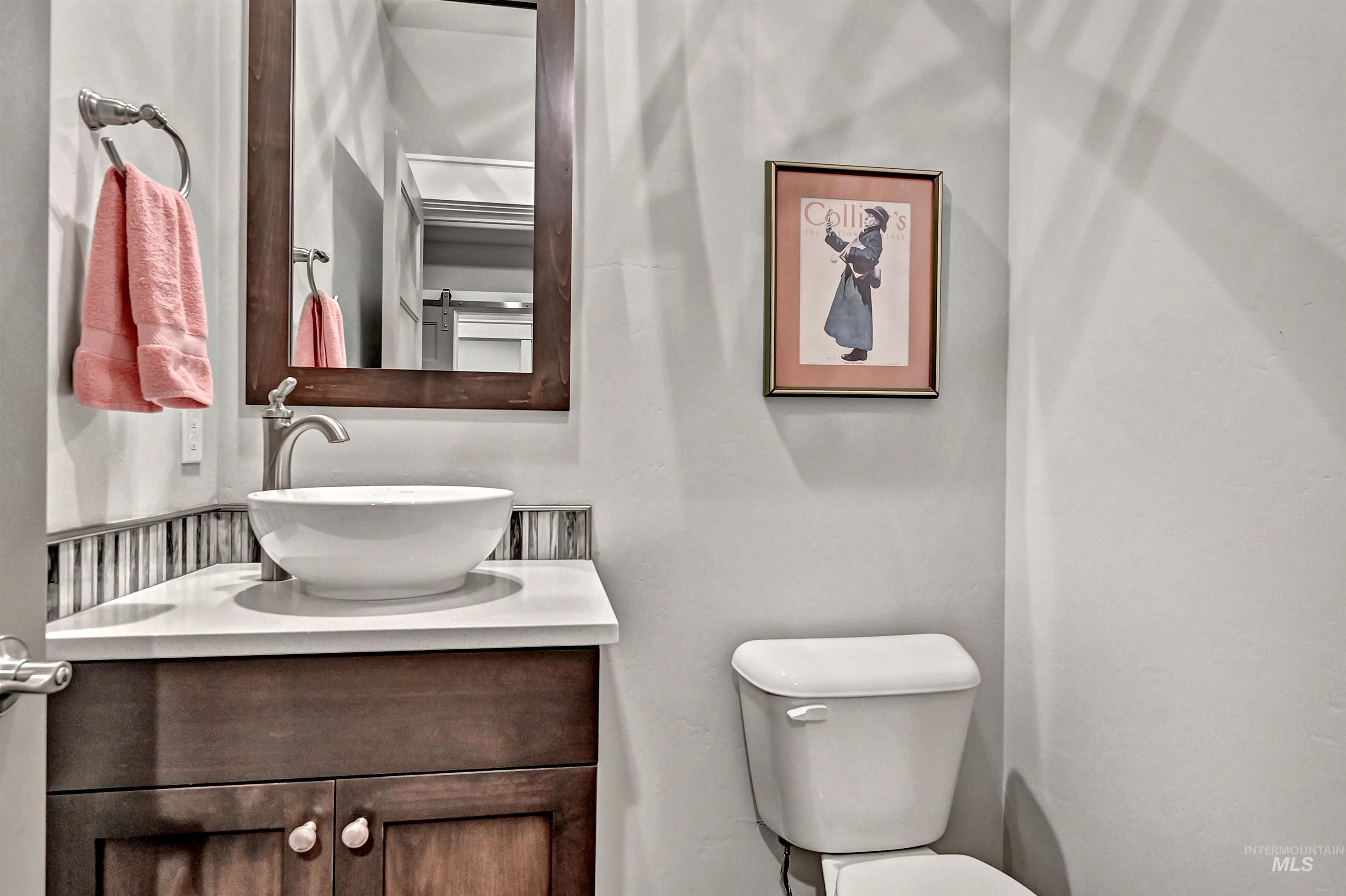 5802 South Wayland Way Meridian, ID 83642 - Photo 31 of 35 Half bathroom featuring vanity, sink, and toilet