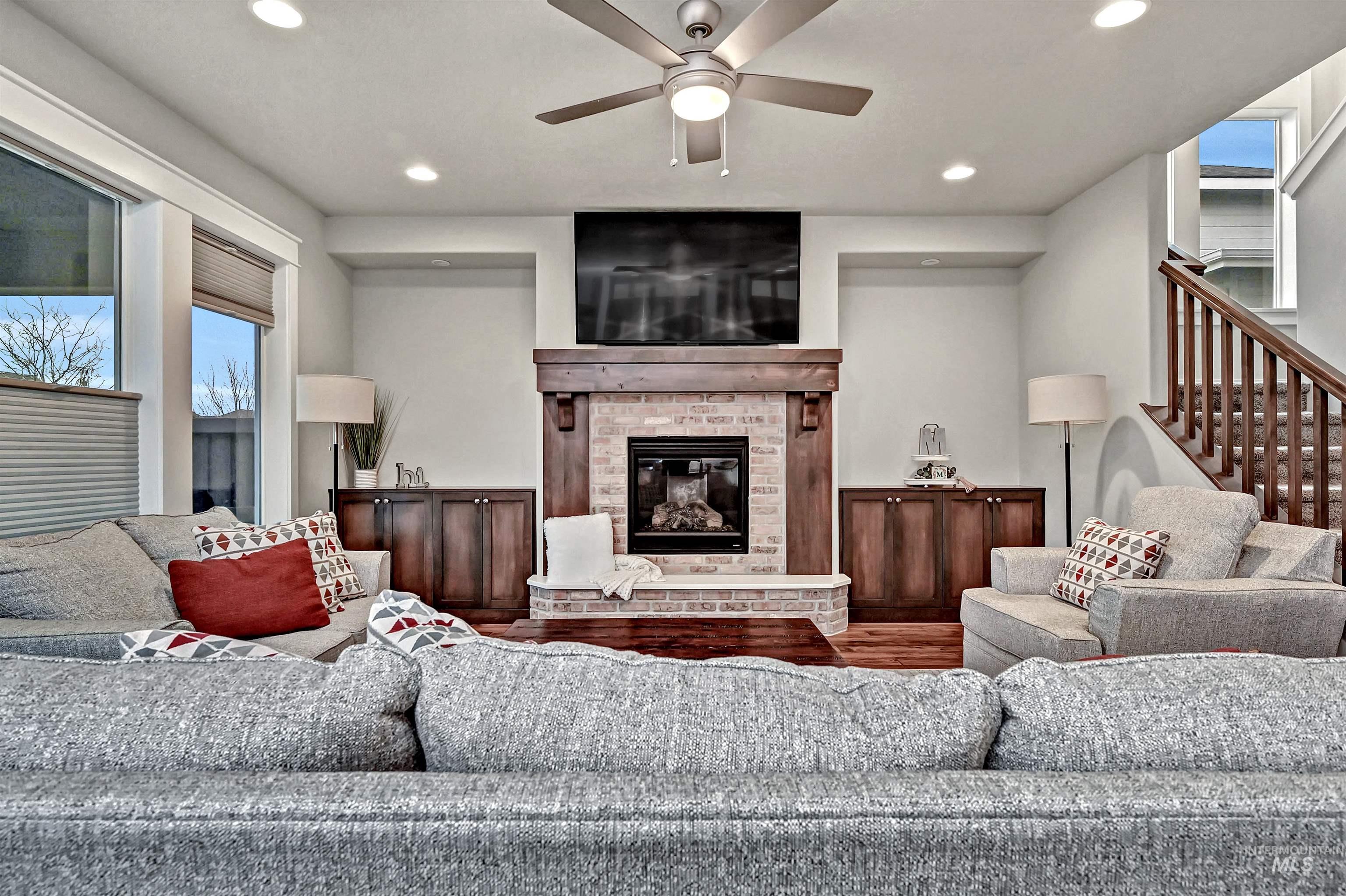 5802 South Wayland Way Meridian, ID 83642 - Photo 6 of 35 Open-style great room featuring engineered-wood flooring, a ceiling fan, a view into the kitchen & dining area, and recessed lighting