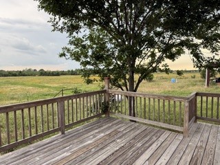 1240 Crooked Road Cat Spring, TX 78933 - Photo 7 of 20 a view of wooden deck and a garden