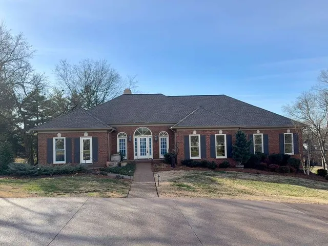 front view of a house with a yard