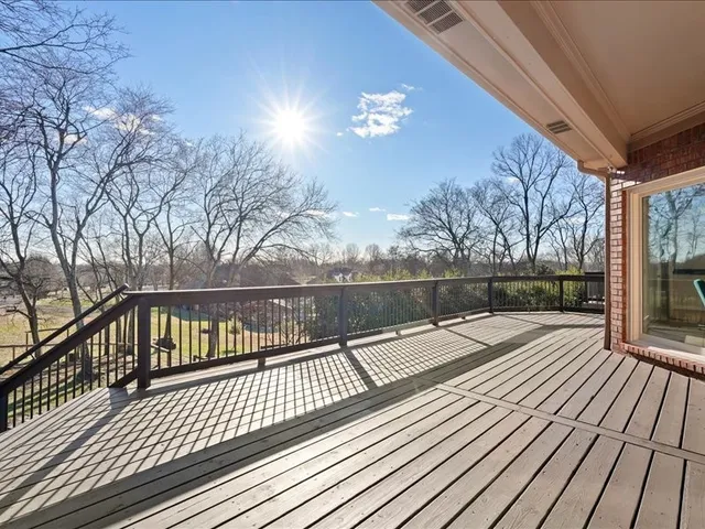 a bedroom with a bed and a night stand
