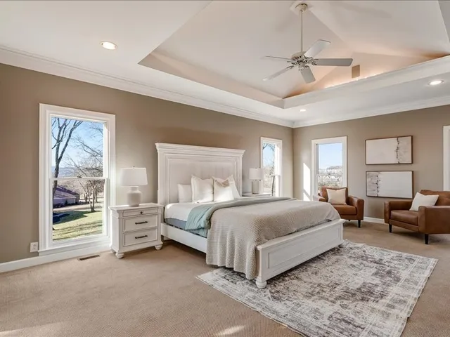 a white bath tub sitting next to a bathroom sink