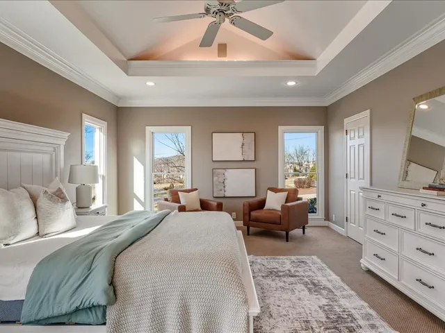 a bathroom with a double vanity sink and shower