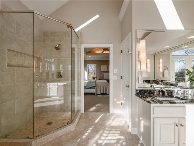 a bathroom with a sink a mirror and toilet
