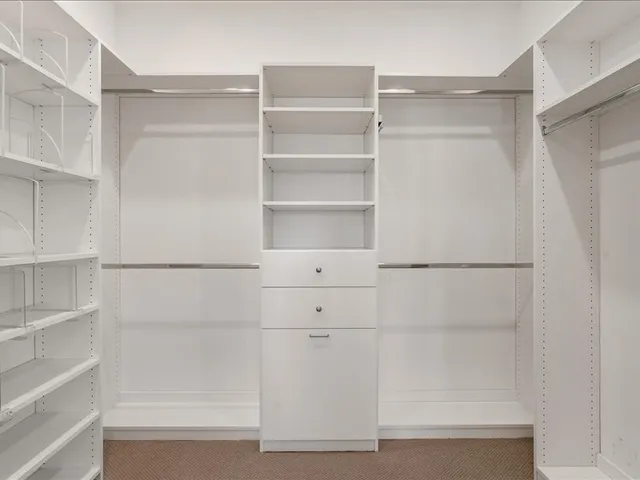 a view of a kitchen with a sink and a window