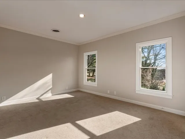 a view of a swimming pool with a lounge chairs