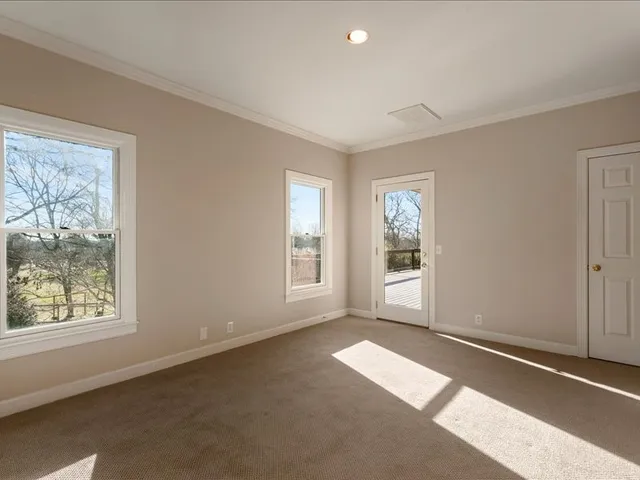 a view of a swimming pool with a yard