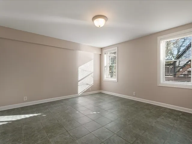 a view of a wooden deck with a yard