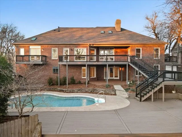 a view of a chair and table in the patio