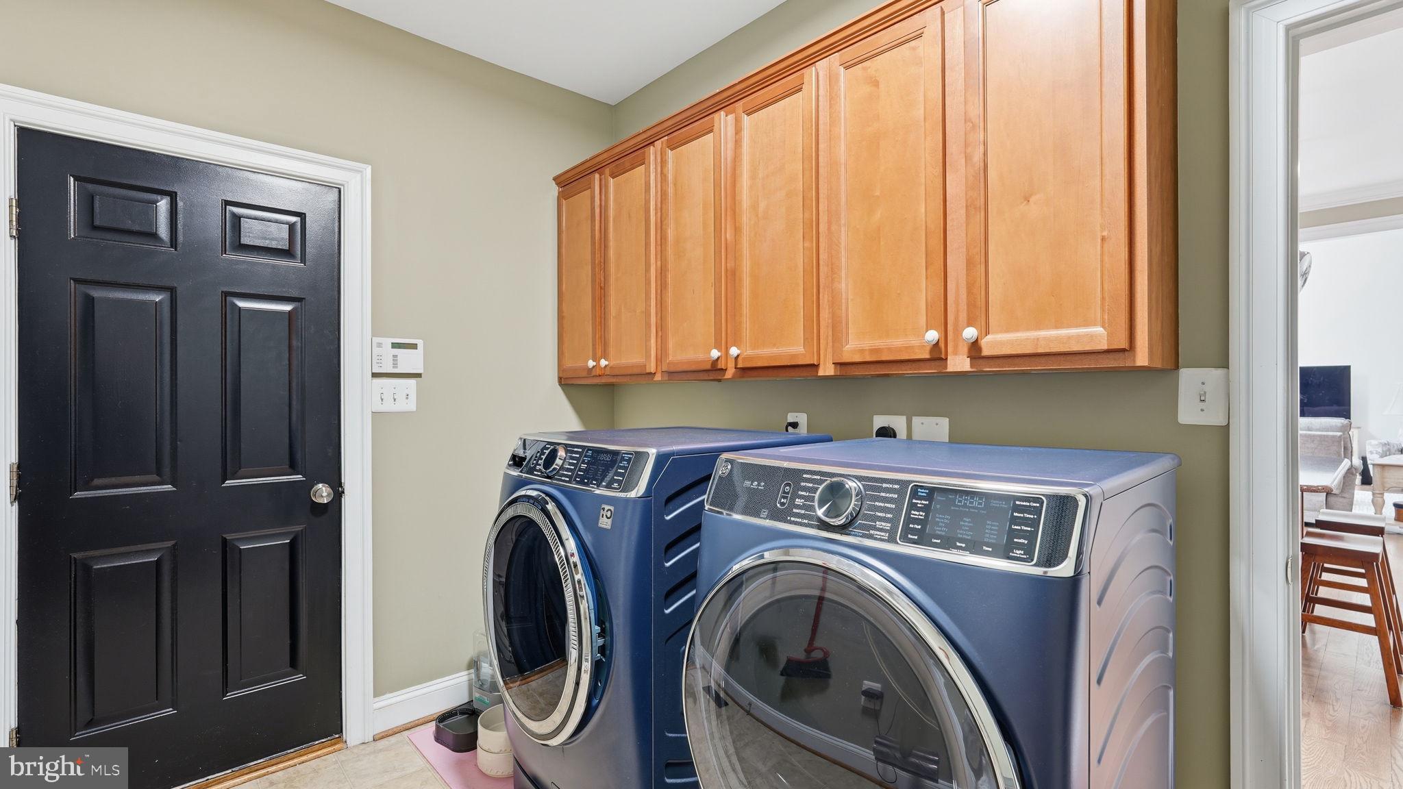 15613 Thoroughfare Road Gainesville, VA 20155 - Photo 16 of 64 Modern laundry space with stylish finishes.