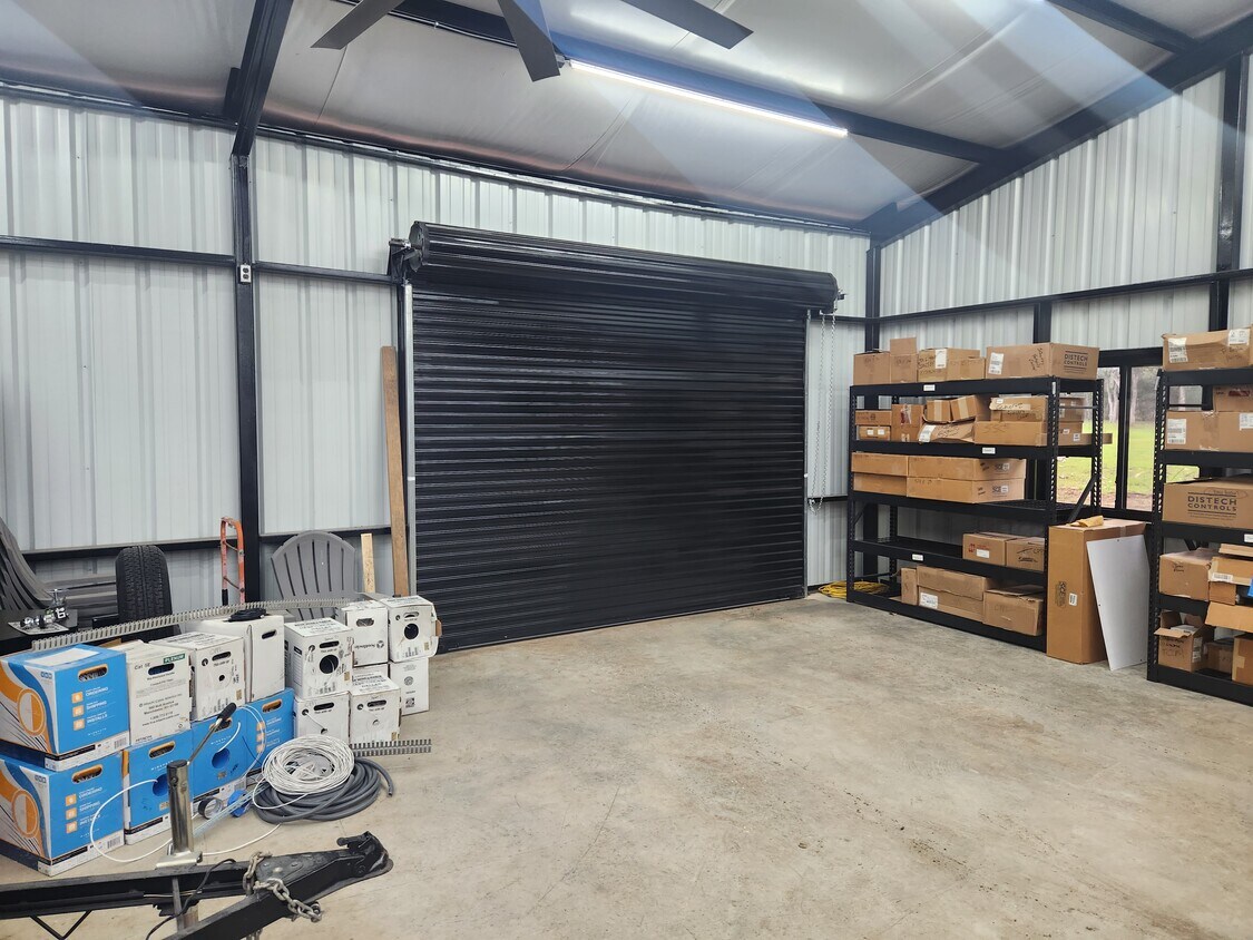 102 County Road 180 Leander, TX 78641 - Photo 23 of 25 A spacious utility area offering ample storage and easy access with a rolling door.