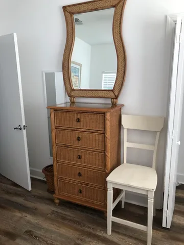 a bathroom with a mirror a toilet and a sink