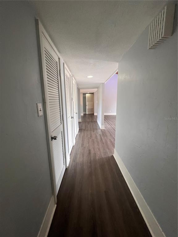 2266 Burnway Road, Unit 2266 Haines City, FL 33844 - Photo 11 of 13 a view of a hallway with wooden floor and staircase