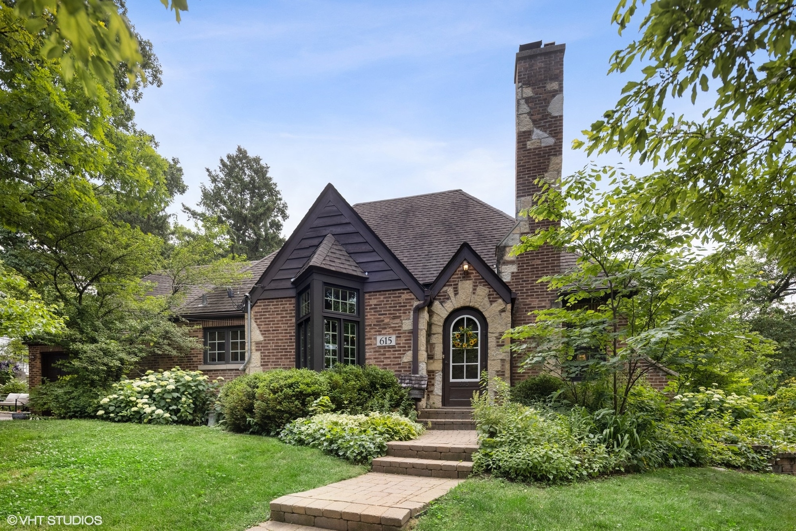 615 Riford Road Glen Ellyn, IL 60137 - Photo 1 of 33 a front view of a house with a yard