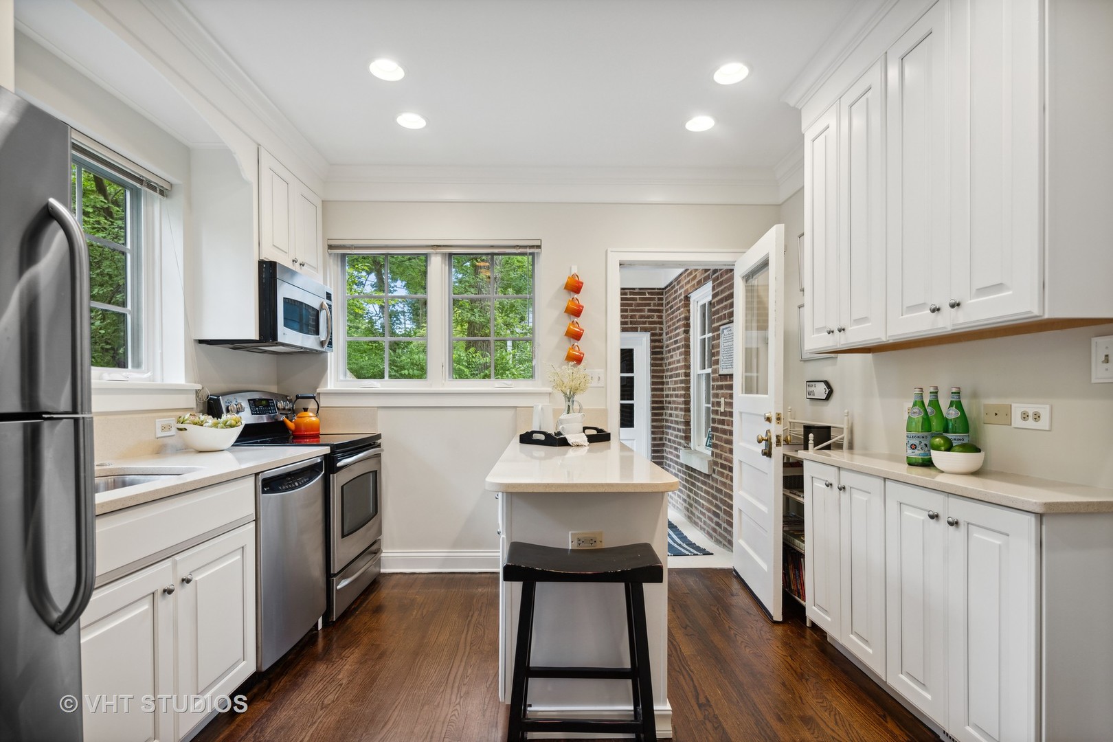 615 Riford Road Glen Ellyn, IL 60137 - Photo 11 of 33 a kitchen with a sink cabinets and wooden floor