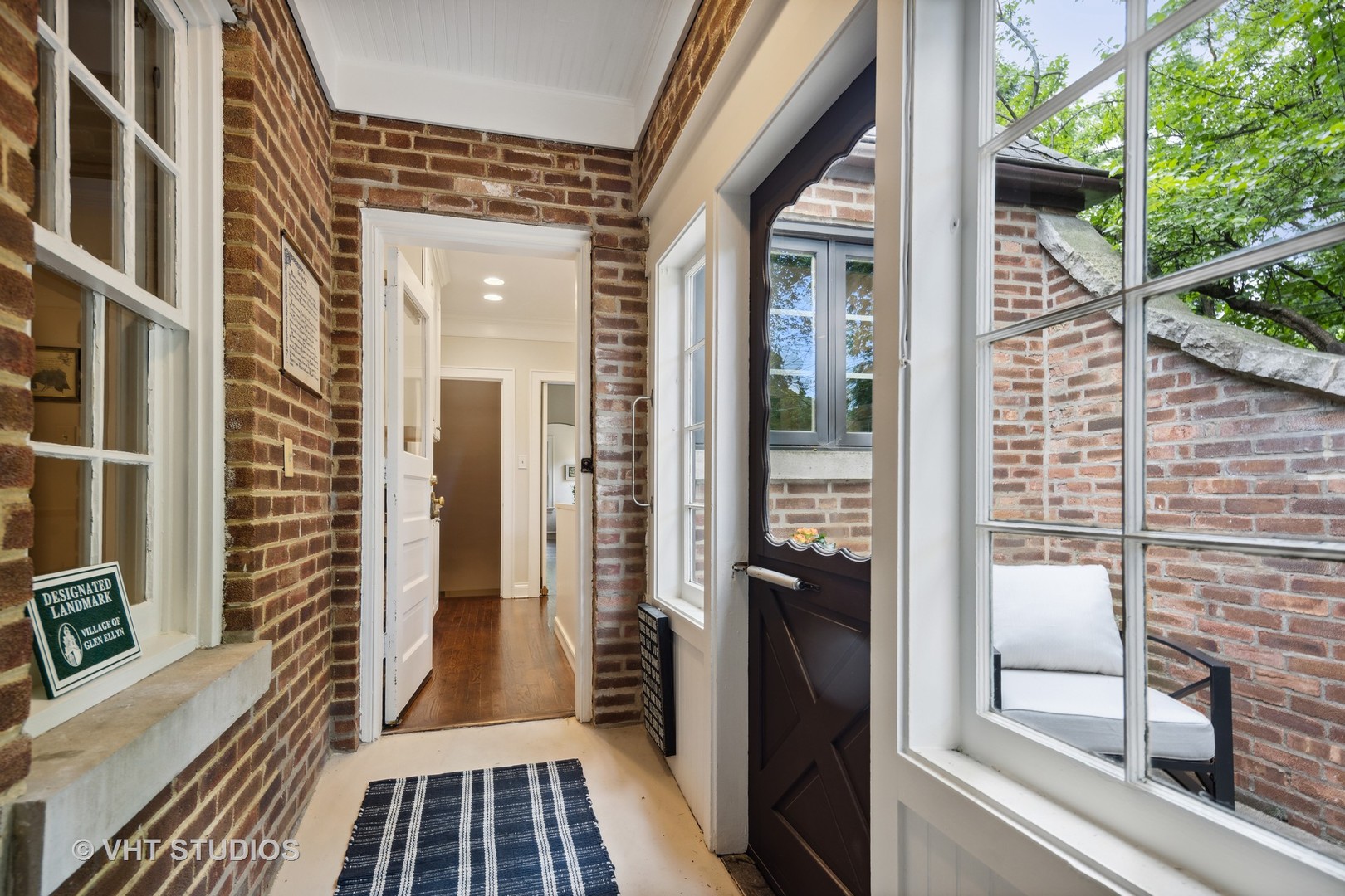 615 Riford Road Glen Ellyn, IL 60137 - Photo 12 of 33 a view of a balcony with wooden floor and a potted plant