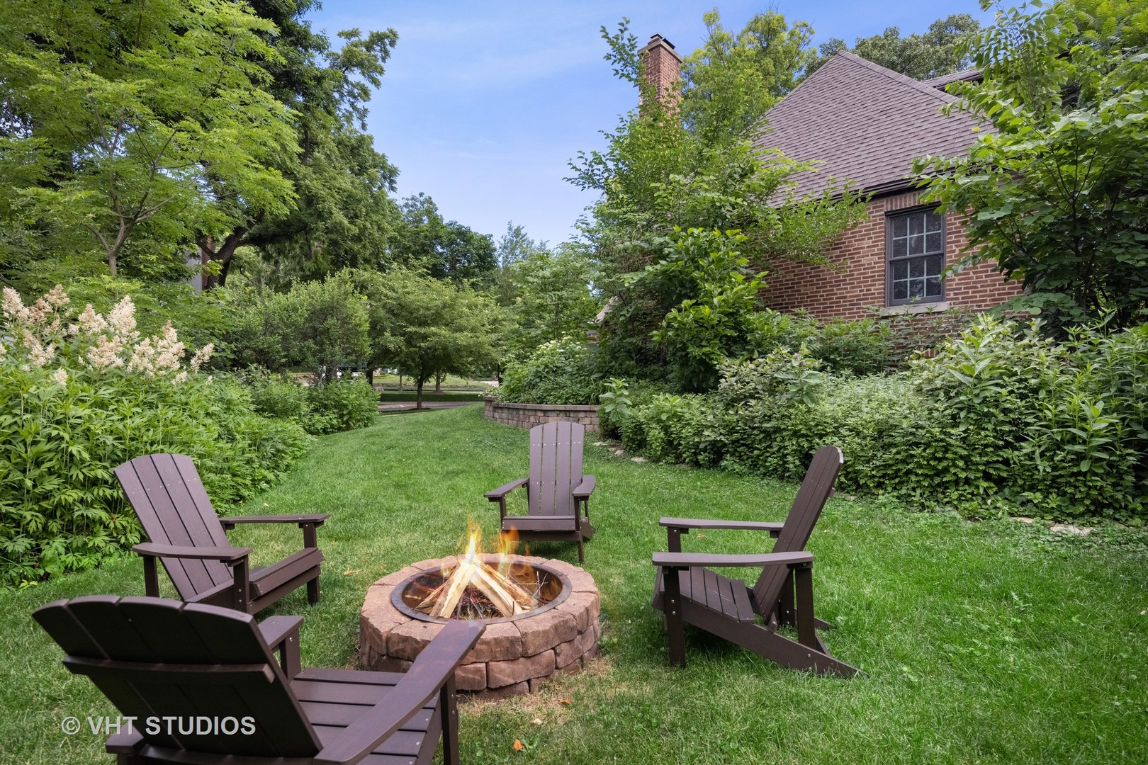 615 Riford Road Glen Ellyn, IL 60137 - Photo 3 of 33 a backyard of a house with outdoor seating
