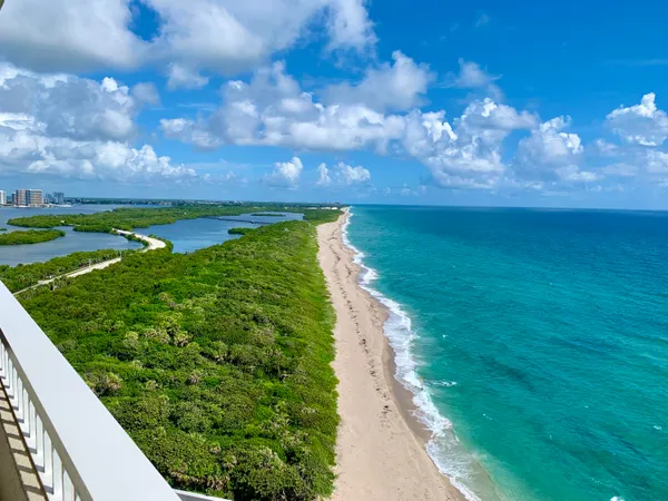 a view of a balcony with an ocean