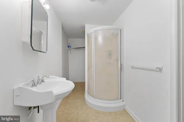 a bathroom with a sink and mirror