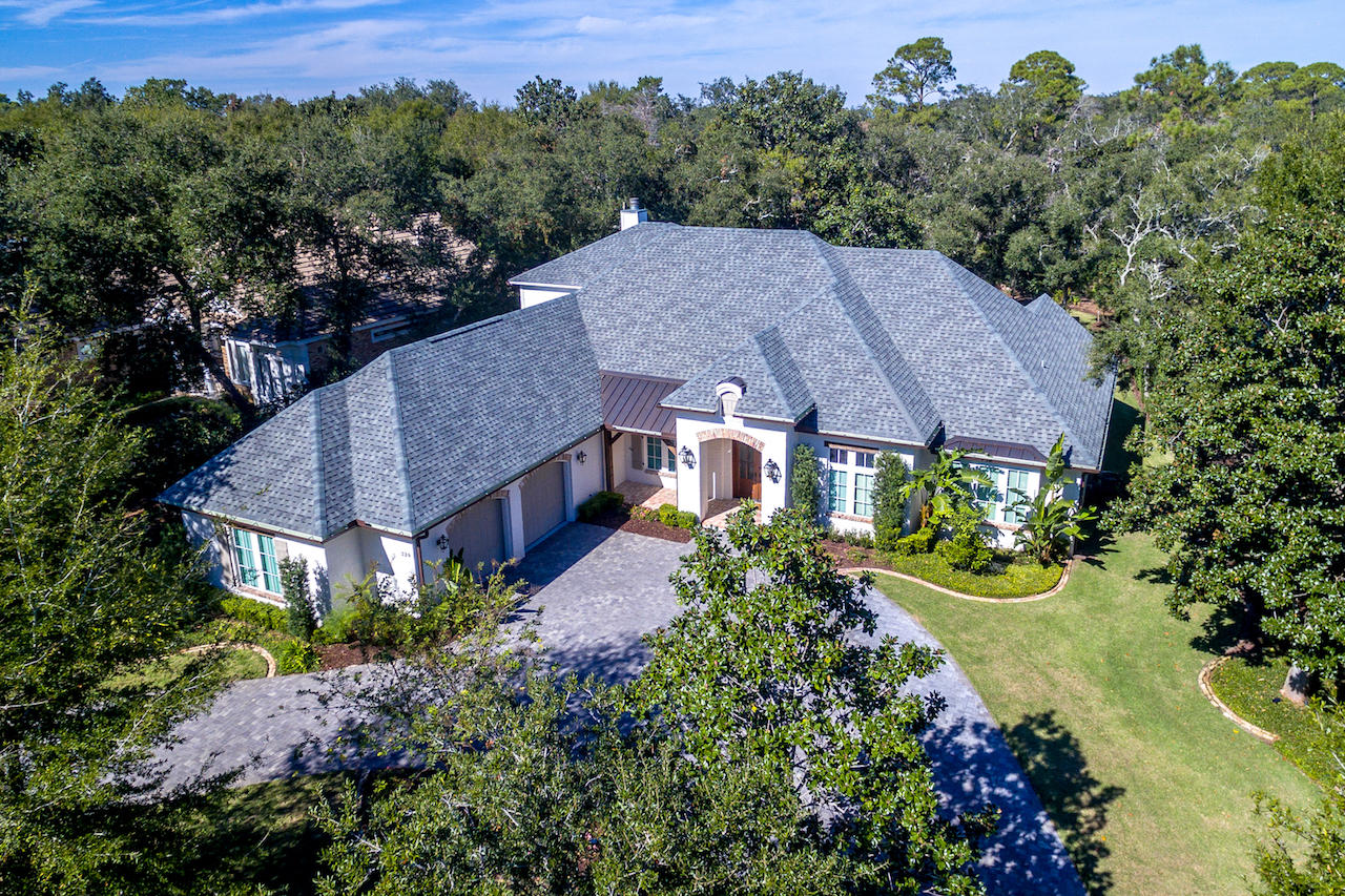 239 Mattie's Way Destin, FL 32541 - Photo 1 of 53 an aerial view of a house with a garden