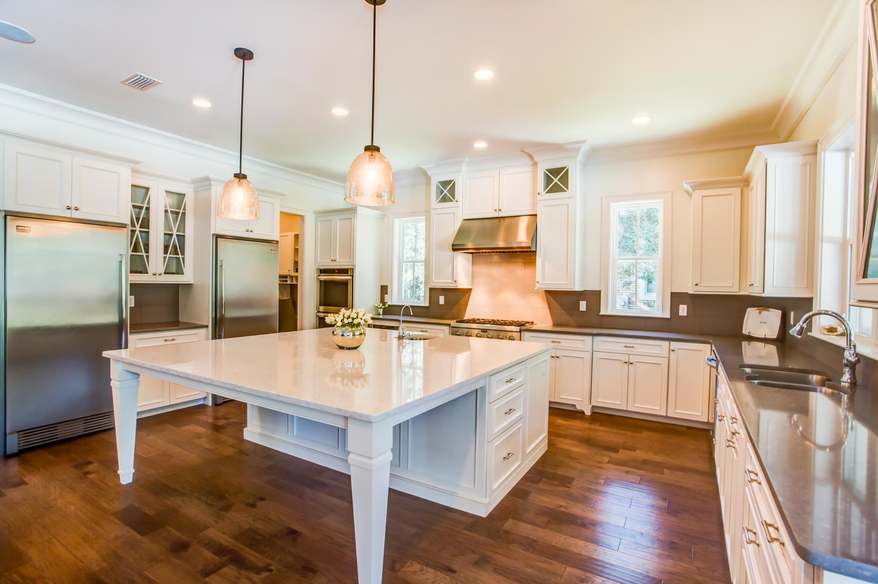 239 Mattie's Way Destin, FL 32541 - Photo 12 of 53 a large kitchen with kitchen island a sink appliances and a counter top space