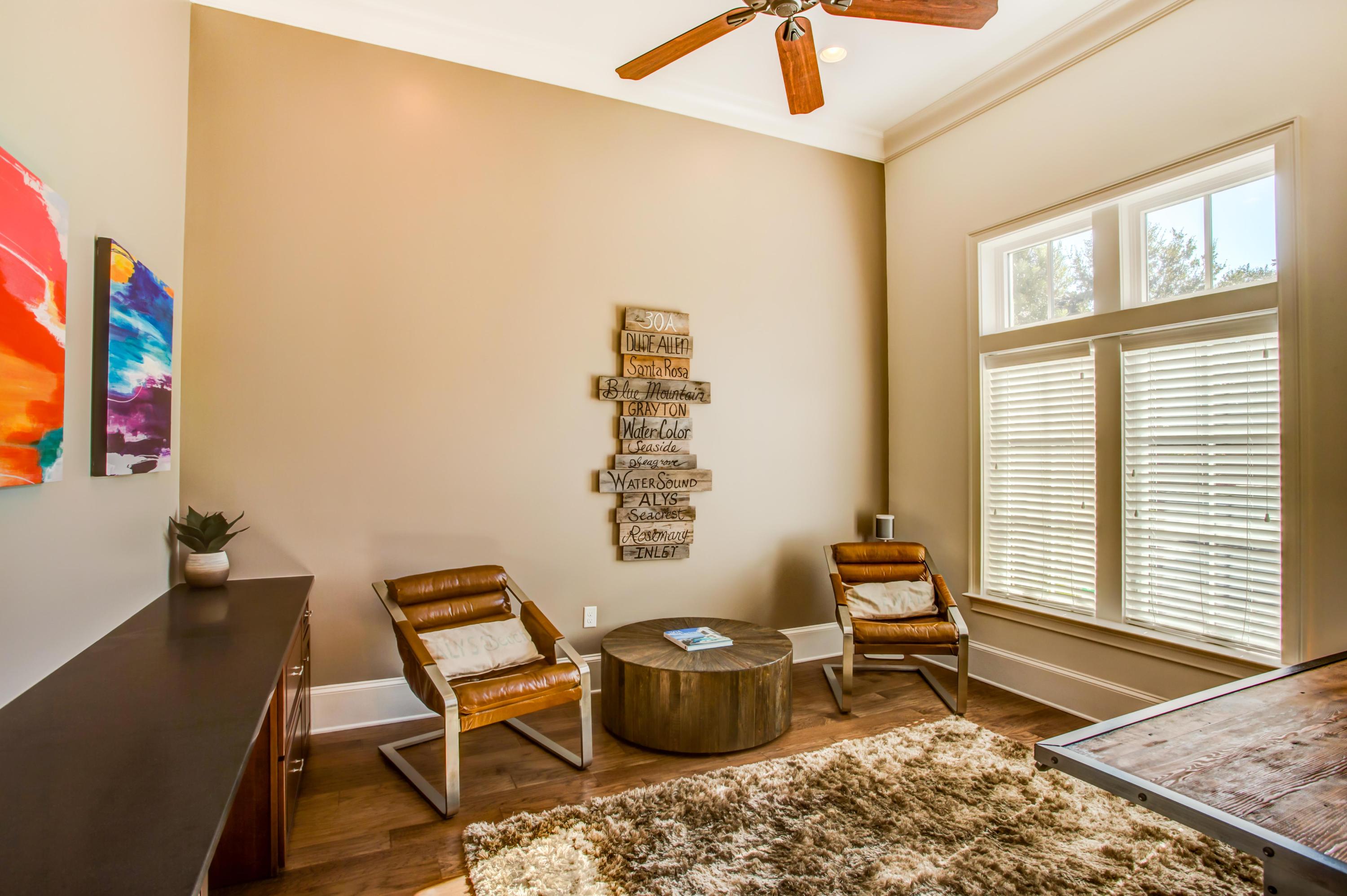 239 Mattie's Way Destin, FL 32541 - Photo 24 of 53 a living room with furniture and a window