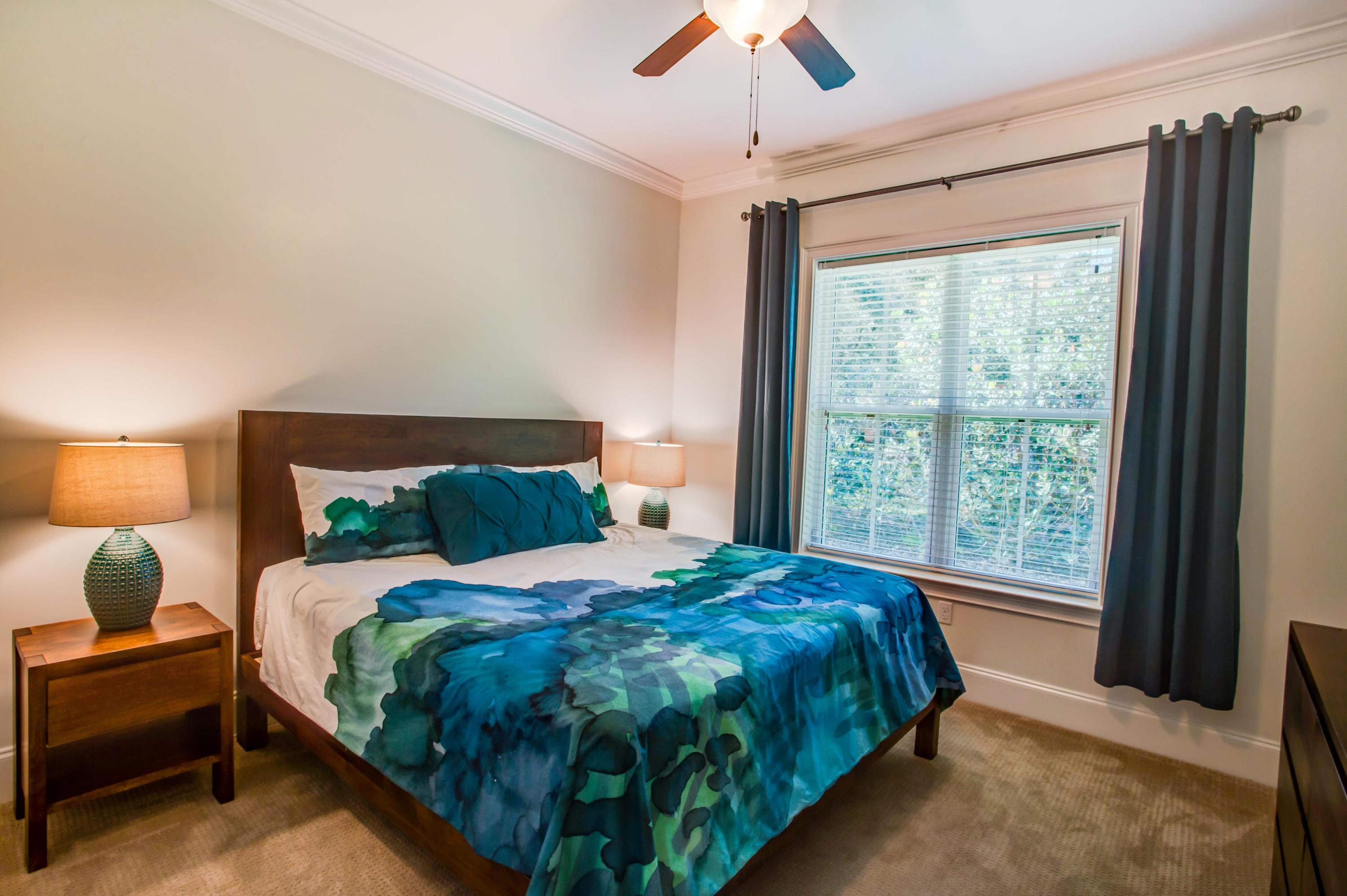 239 Mattie's Way Destin, FL 32541 - Photo 25 of 53 a bedroom with a large bed and a large window