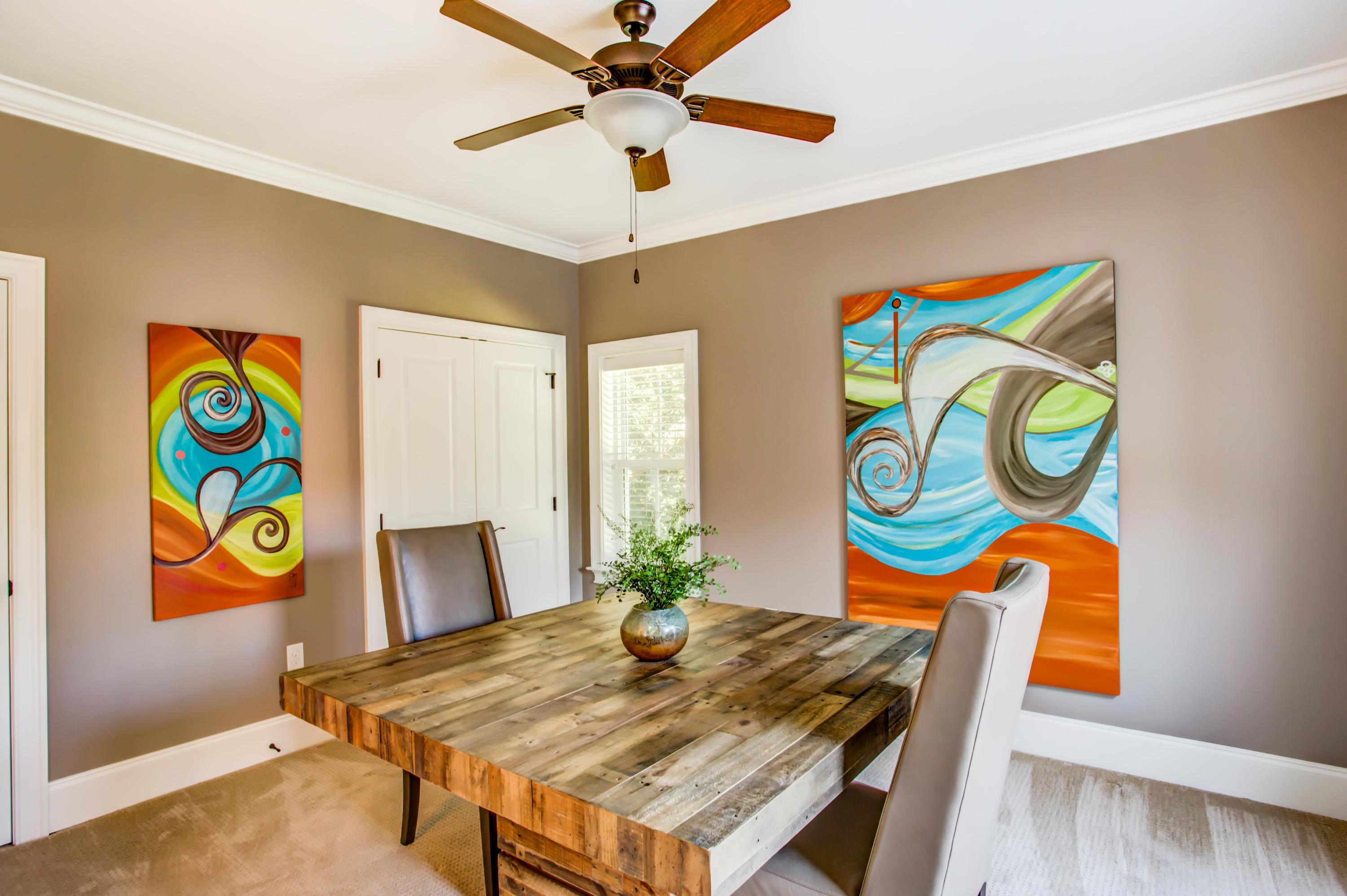 239 Mattie's Way Destin, FL 32541 - Photo 32 of 53 a view of a dining room with furniture and wooden floor