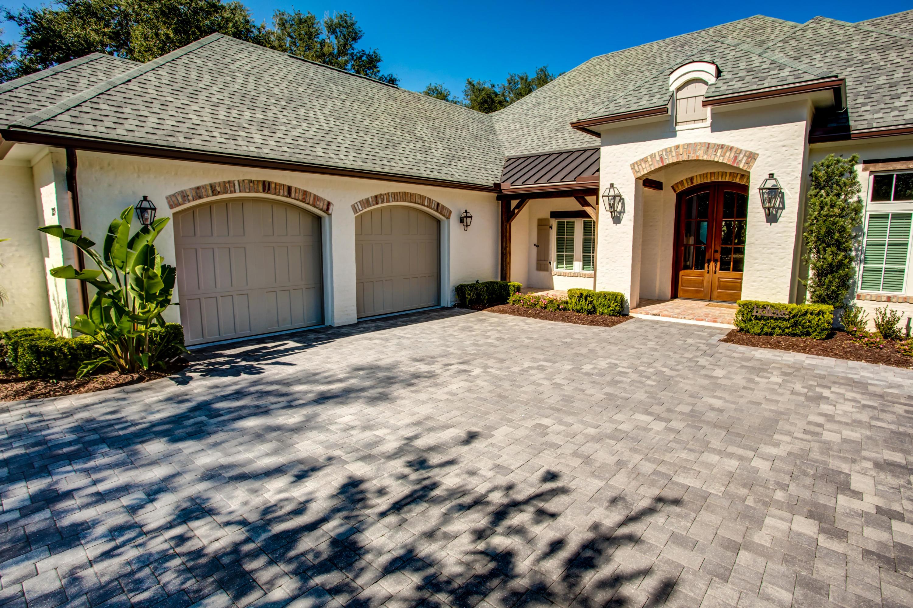 239 Mattie's Way Destin, FL 32541 - Photo 43 of 53 a front view of a house with garden