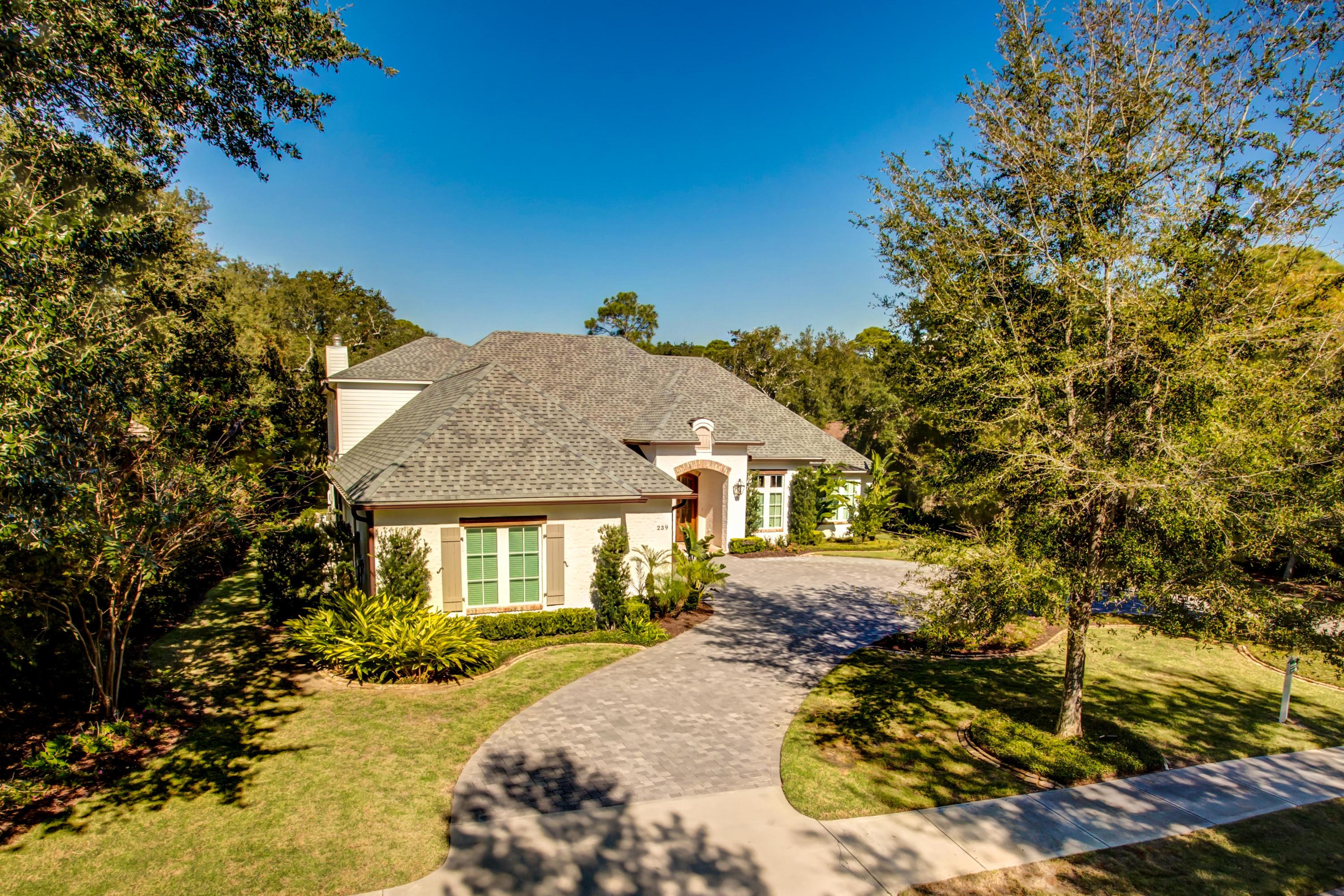 239 Mattie's Way Destin, FL 32541 - Photo 44 of 53 a front view of a house with a yard