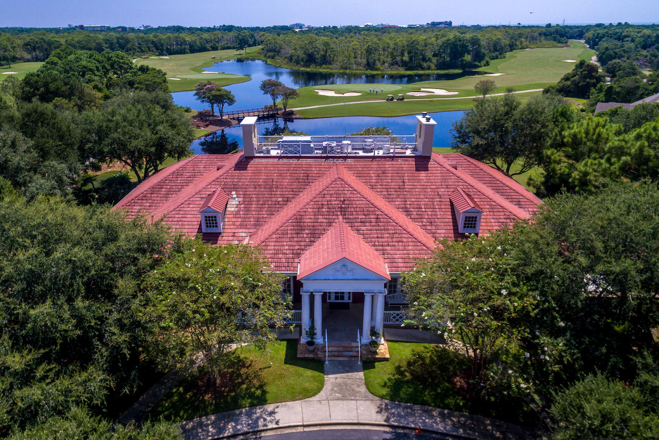 239 Mattie's Way Destin, FL 32541 - Photo 48 of 53 an aerial view of a house with a garden and lake view