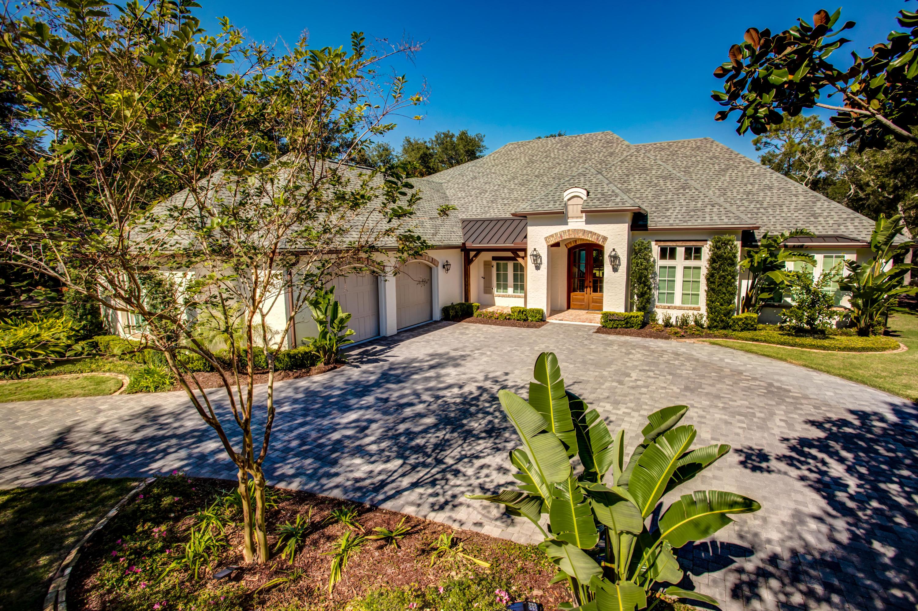 239 Mattie's Way Destin, FL 32541 - Photo 5 of 53 a front view of a house with a yard