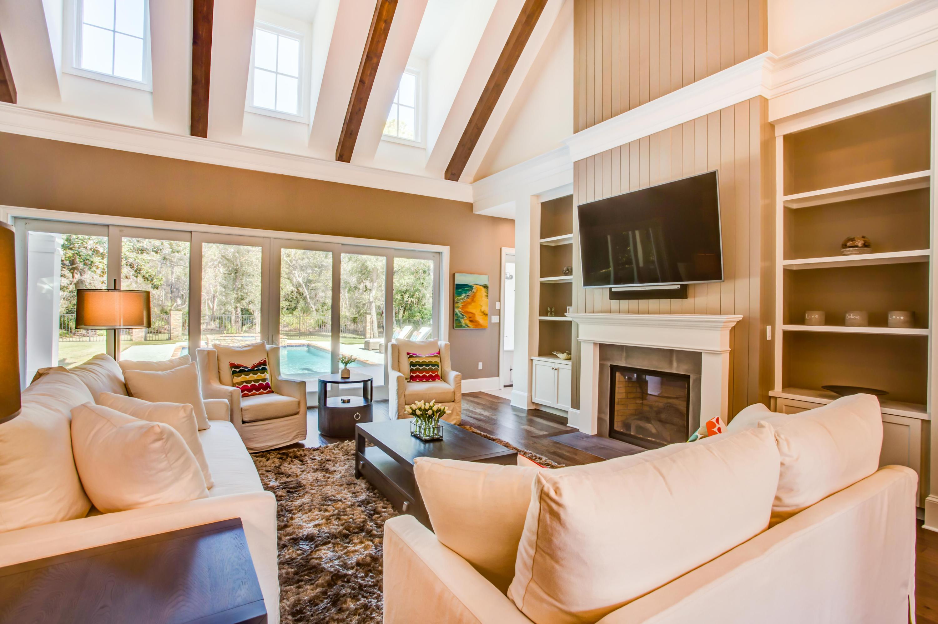 239 Mattie's Way Destin, FL 32541 - Photo 6 of 53 a living room with furniture a fireplace and a flat screen tv