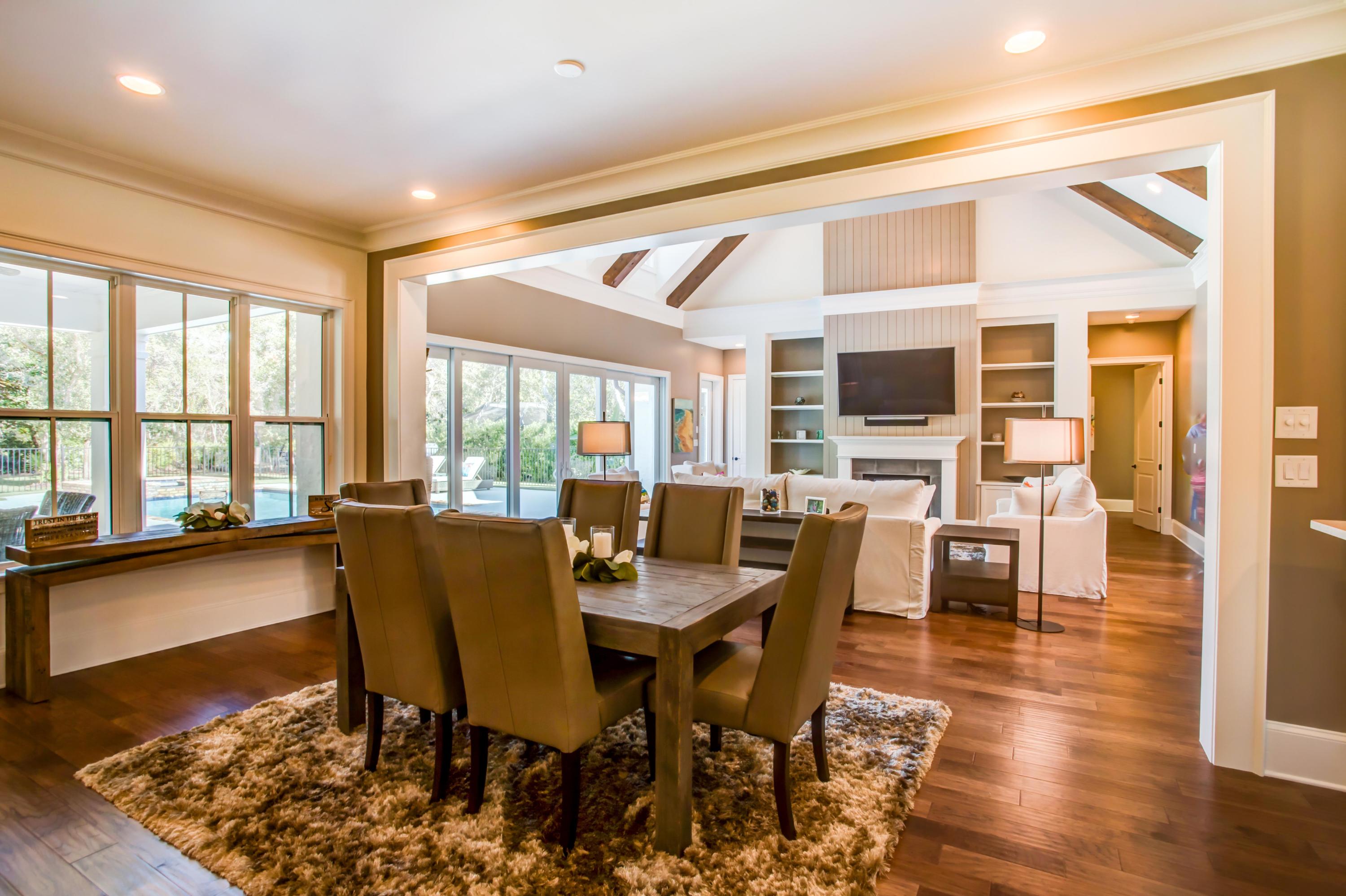 239 Mattie's Way Destin, FL 32541 - Photo 8 of 53 a view of a dining room with furniture window and wooden floor