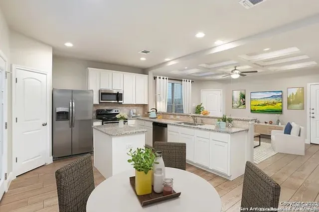 a kitchen with a refrigerator and a sink