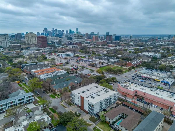 an aerial view of a city with lots of residential buildings