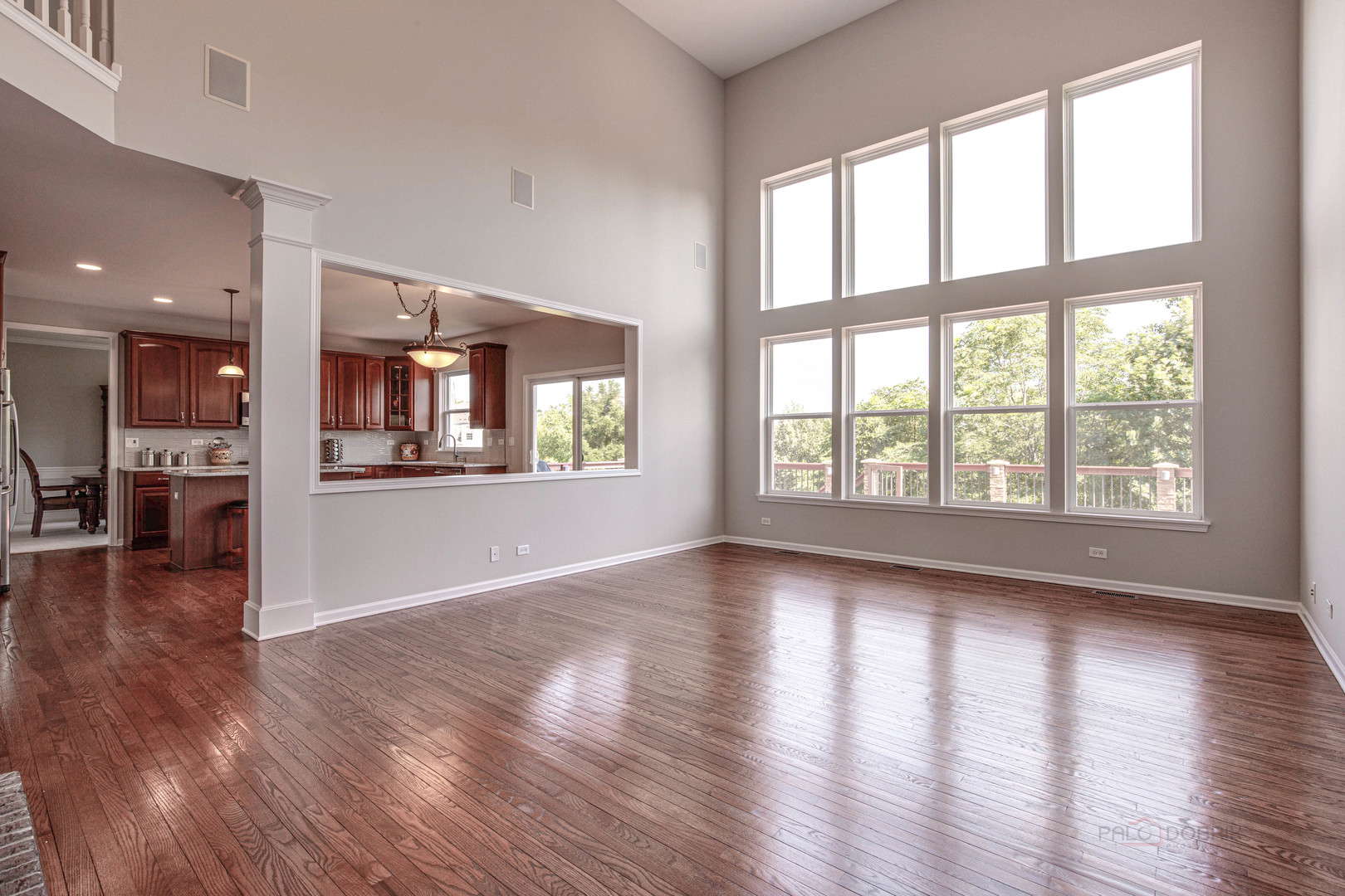 409 Wildflower Way Streamwood, IL 60107 - Photo 16 of 53 an empty room with wooden floor and windows