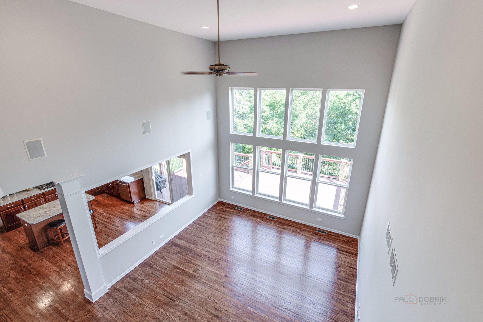 409 Wildflower Way Streamwood, IL 60107 - Photo 17 of 53 an empty room with wooden floor and windows
