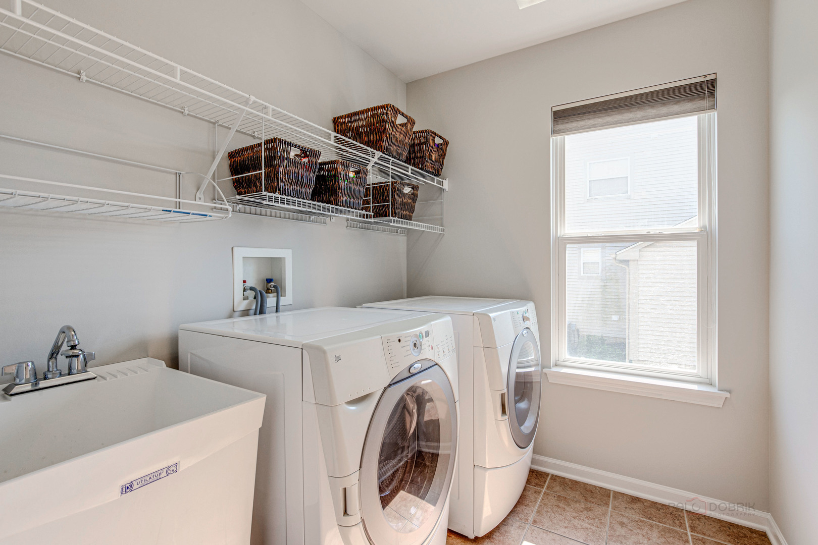 409 Wildflower Way Streamwood, IL 60107 - Photo 19 of 53 a utility room with dryer and washer