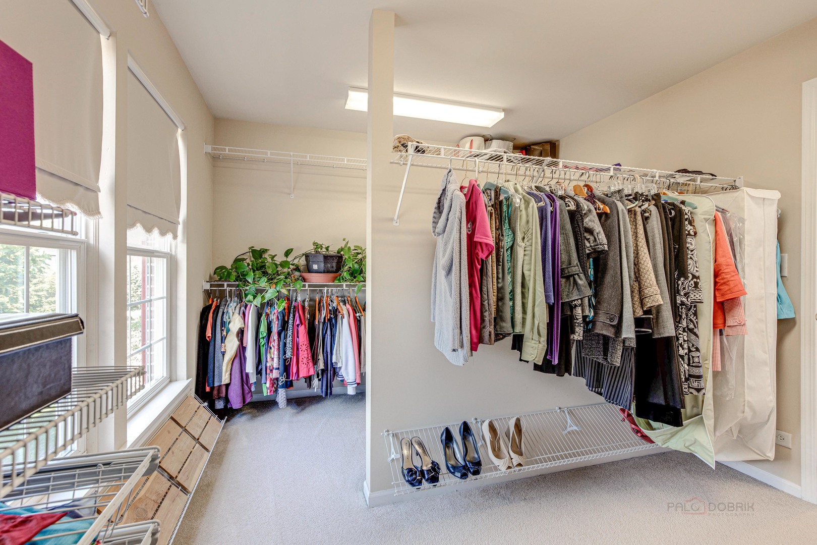 409 Wildflower Way Streamwood, IL 60107 - Photo 24 of 53 a view of walk in closet with clothes