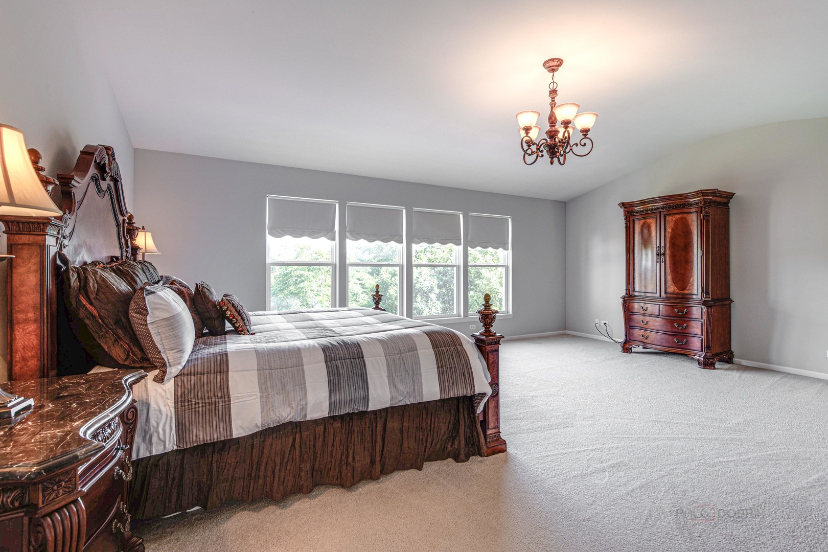 409 Wildflower Way Streamwood, IL 60107 - Photo 25 of 53 a bed sitting in a room next to a window