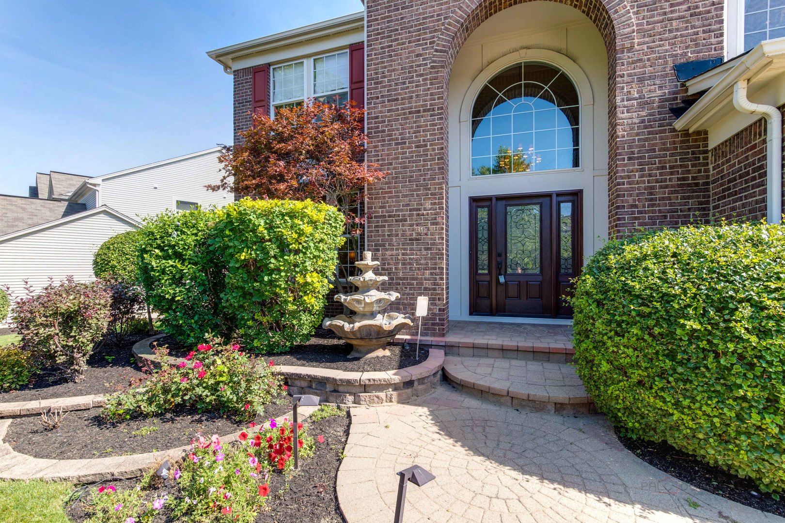 409 Wildflower Way Streamwood, IL 60107 - Photo 3 of 53 a front view of a house with a yard