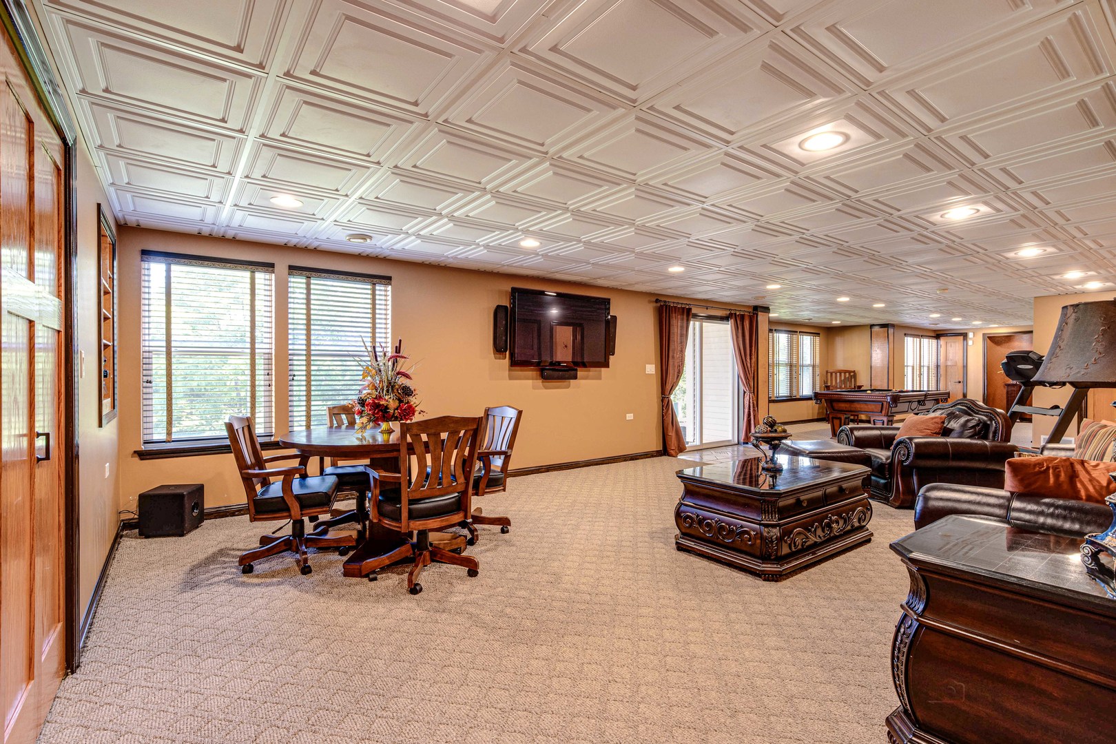 409 Wildflower Way Streamwood, IL 60107 - Photo 32 of 53 a living room with furniture and a flat screen tv