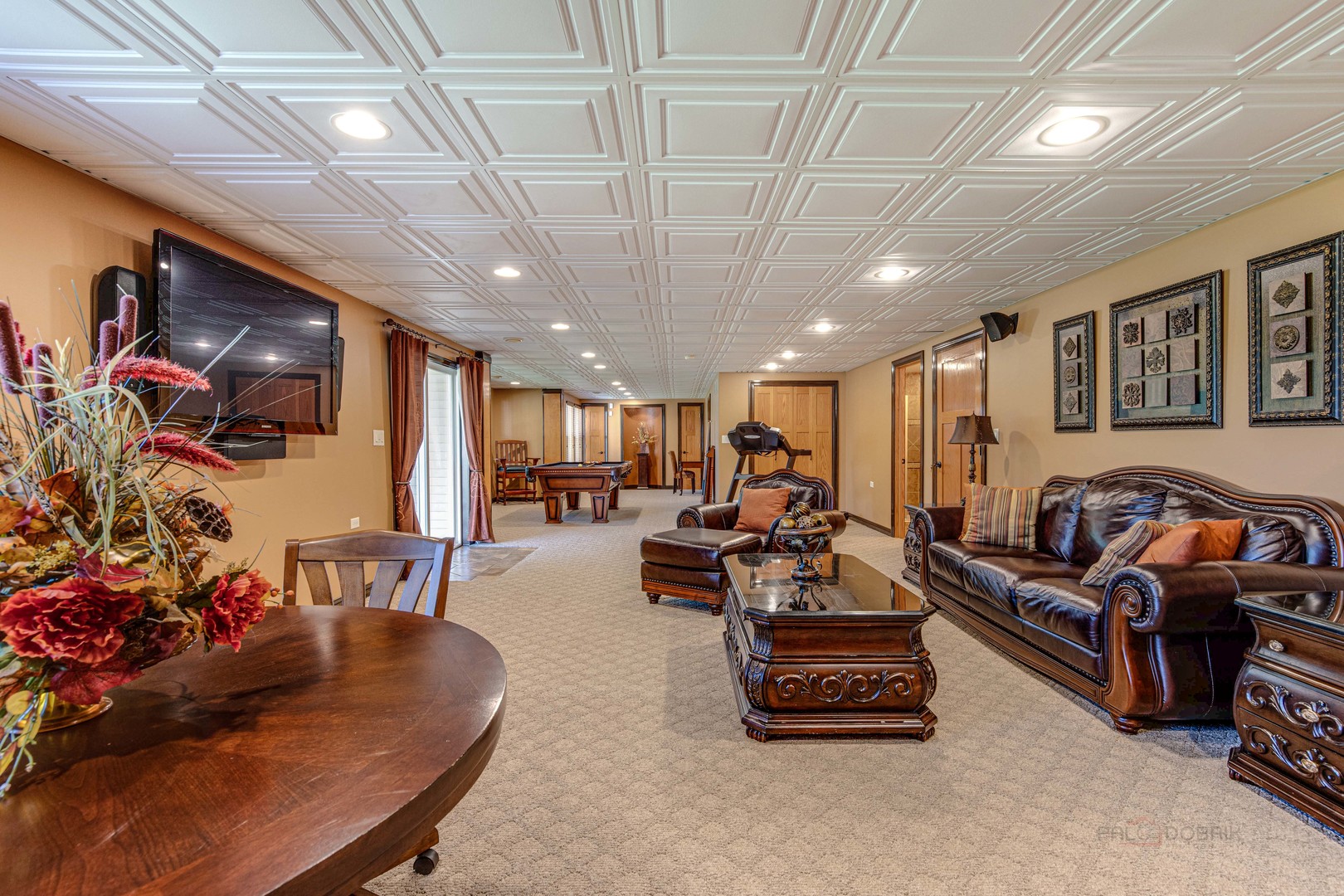 409 Wildflower Way Streamwood, IL 60107 - Photo 33 of 53 a living room with furniture and a chandelier