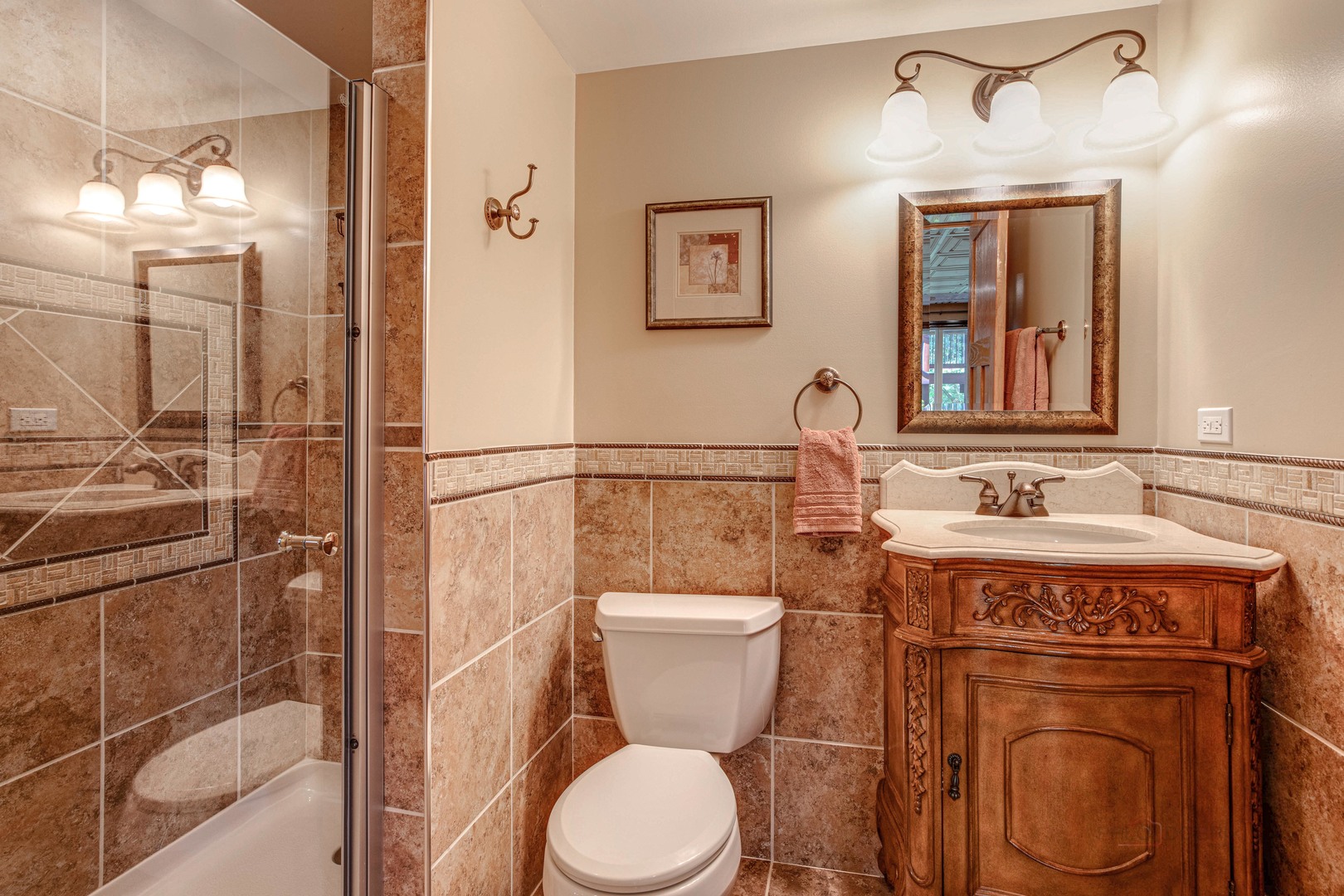 409 Wildflower Way Streamwood, IL 60107 - Photo 36 of 53 a bathroom with a toilet sink and mirror