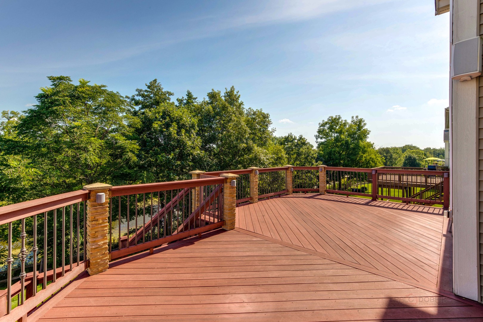 409 Wildflower Way Streamwood, IL 60107 - Photo 38 of 53 a balcony with wooden floor and fence