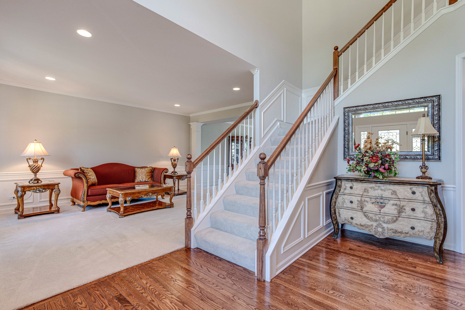 409 Wildflower Way Streamwood, IL 60107 - Photo 4 of 53 a living room with furniture toys and a chandelier